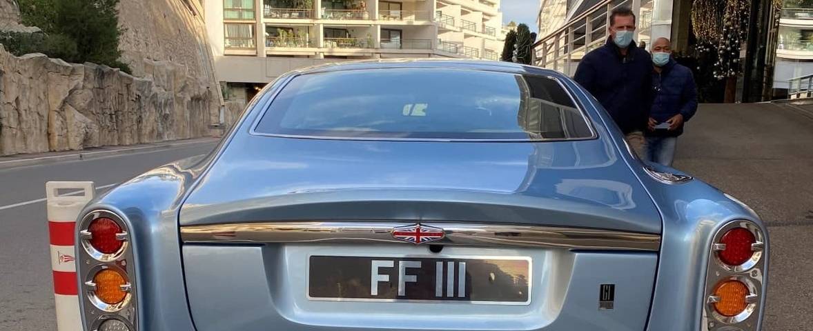Private number plate on historic vehicle on road