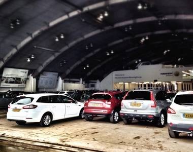 Cat N cars awaiting auction