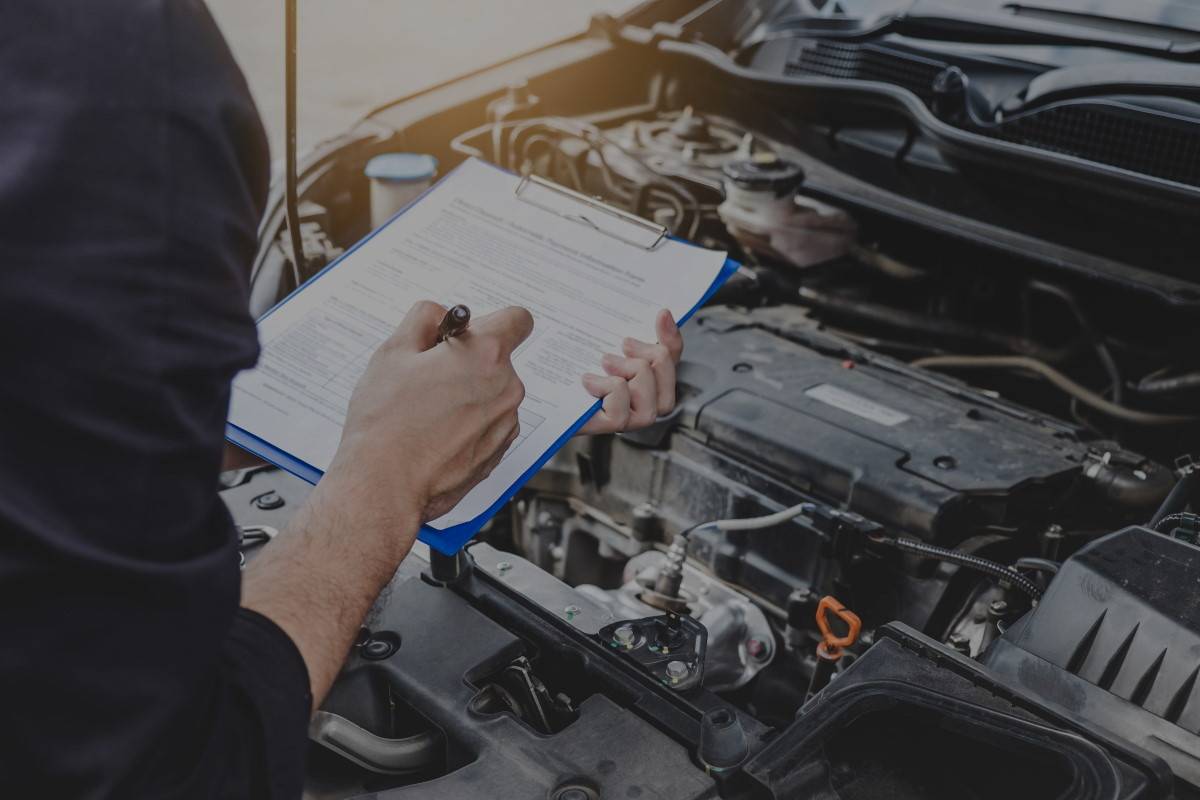 Man doing a Car MOT Check